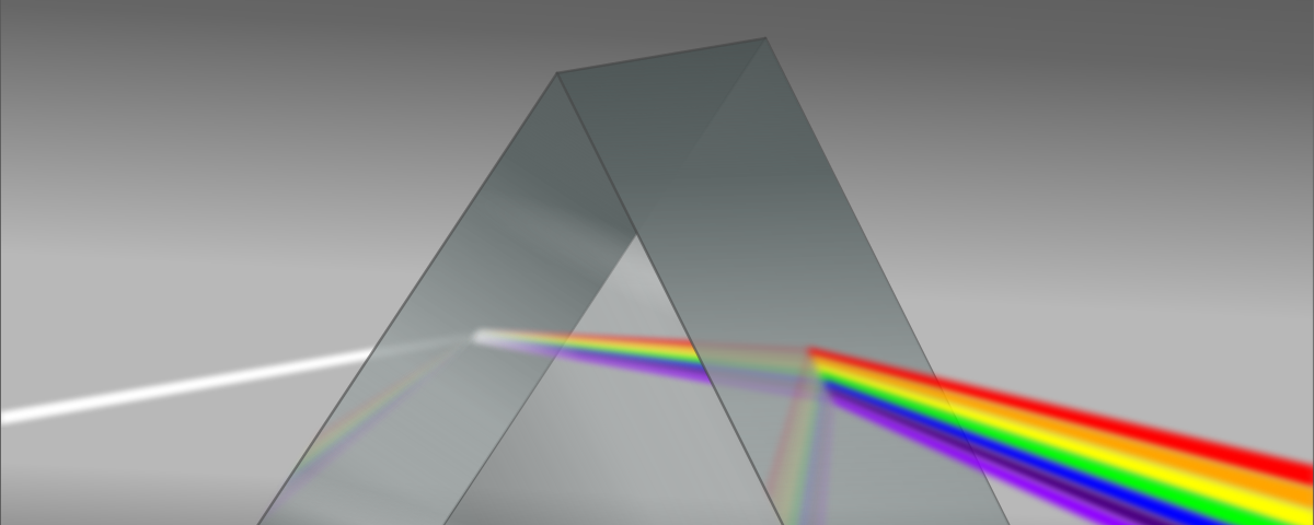 A prism dispering white light into rainbow colors.