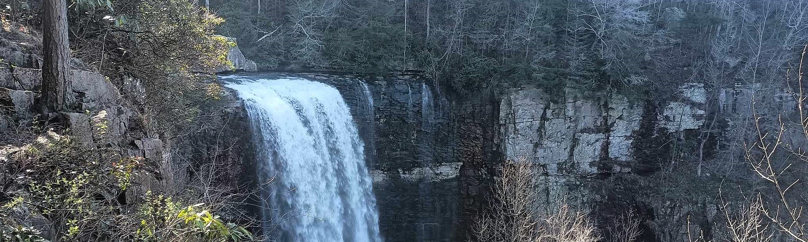 A scenic view of a waterfall from above