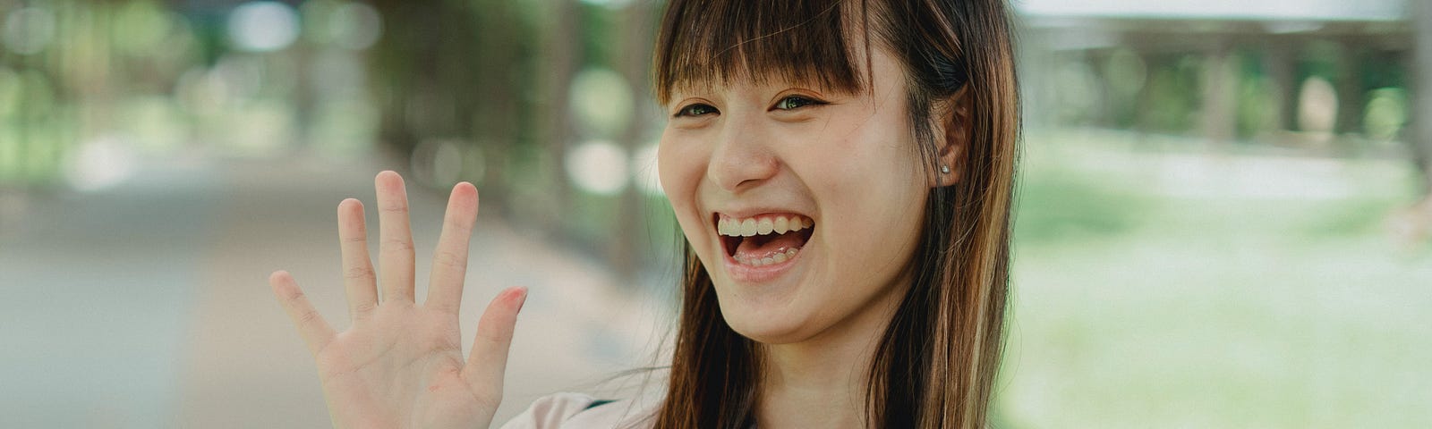 smiling woman waving