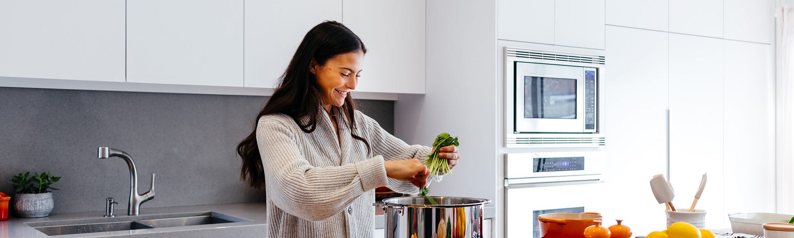 Woman preparing healthy food in a beautiful kitchen