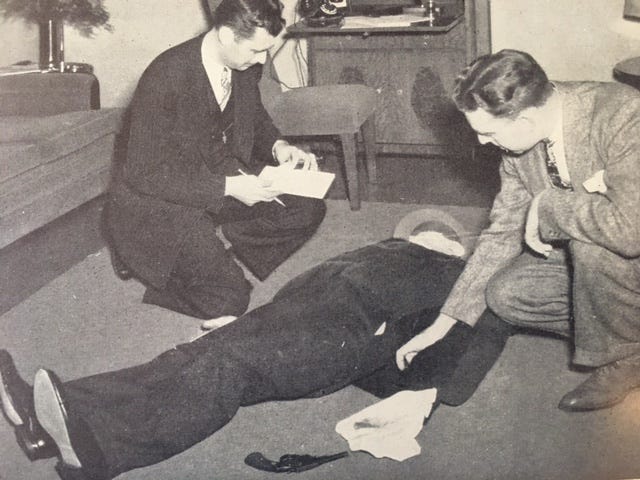 Black and white photo of two men investigating a crime scene from the book “The F.B.I.”