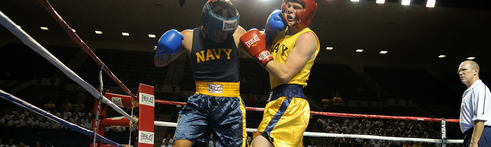 Two boxers fighting in a boxing ring