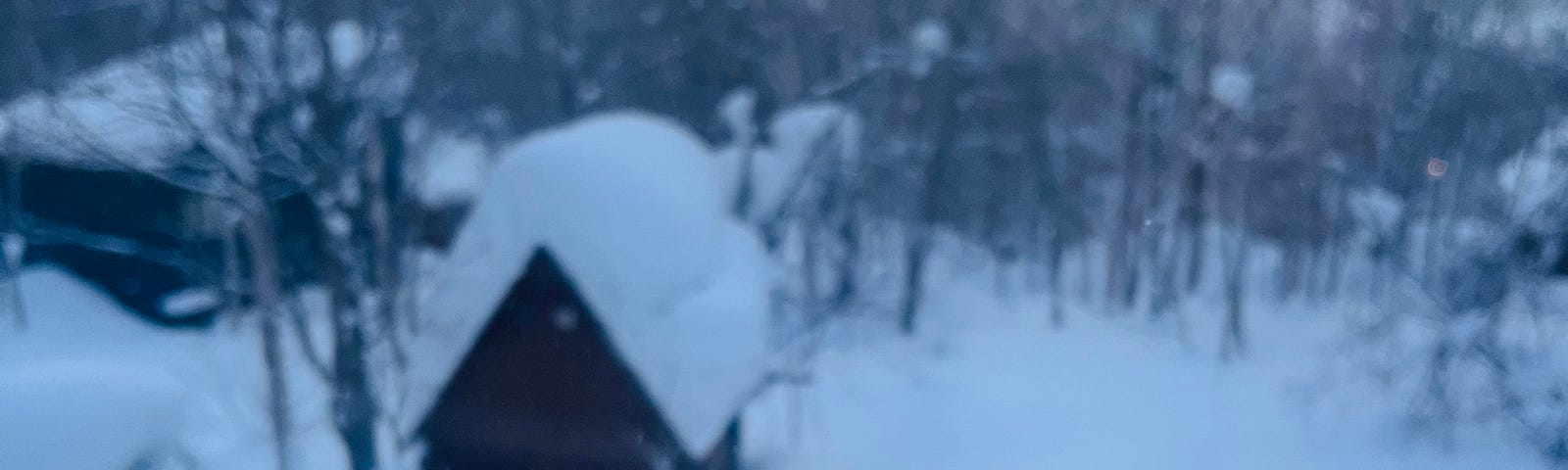 Picture of a cup of coffee in front of a snow landscape