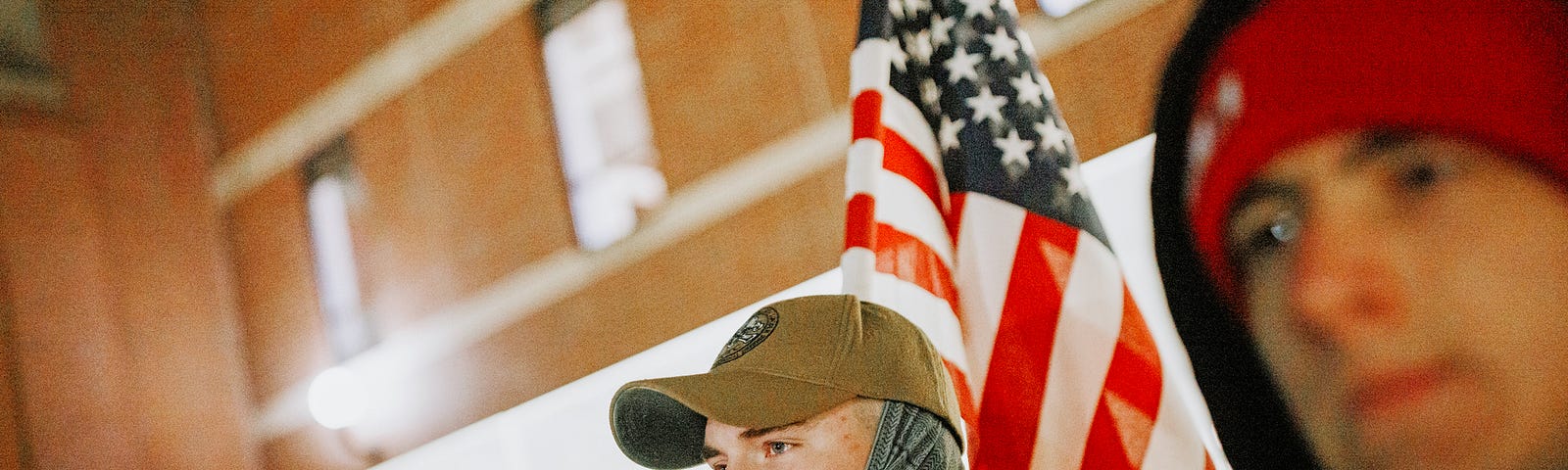 Cohan Bonow, senior in management and a Naval ROTC midshipman, stands with fellow marchers before the start of the marching.