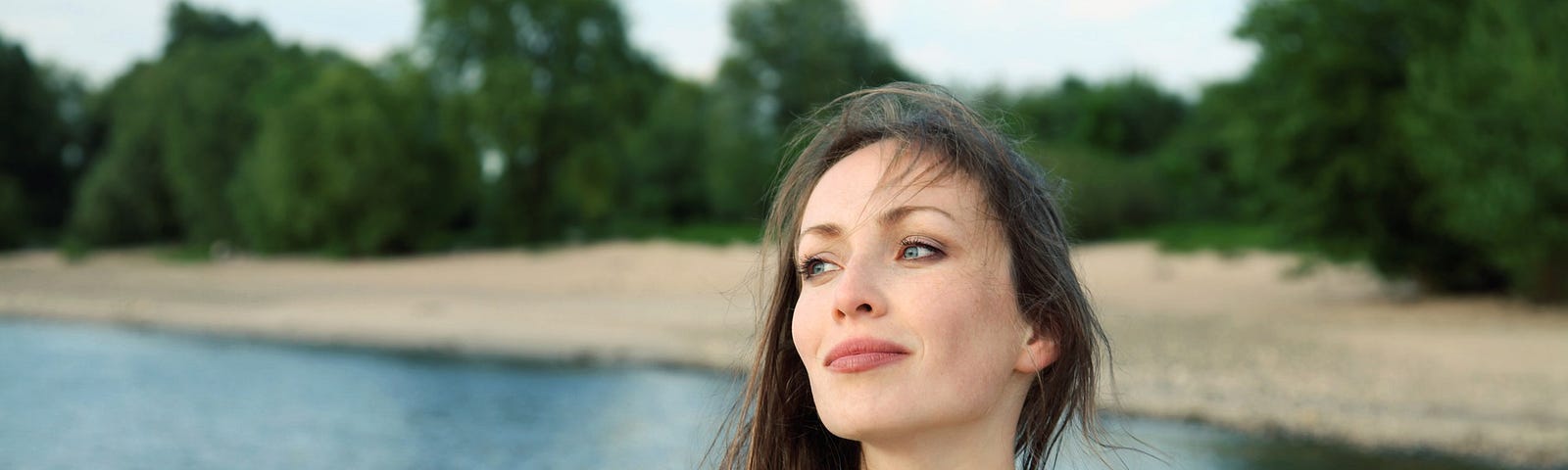 Self love in the woman standing before lake