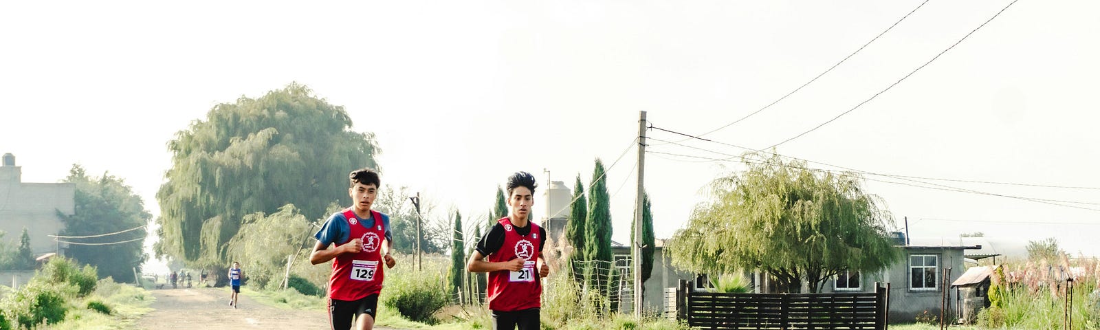 Two boys running in the countryside