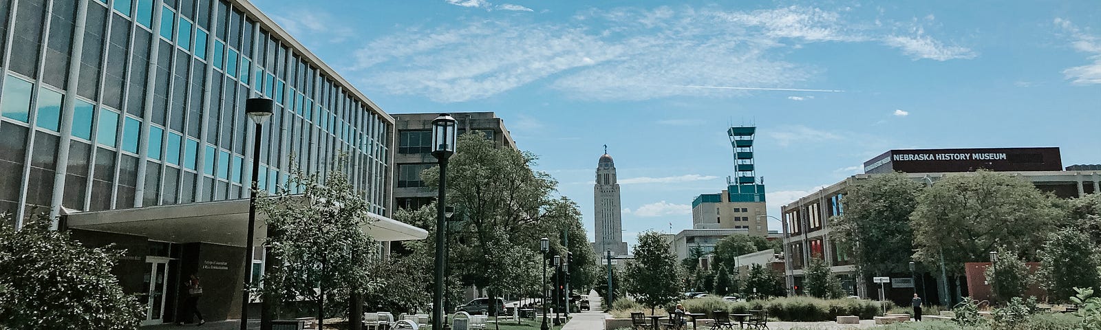 Andersen Hall appears on the left with the Capitol in the distance on a sunny day in Lincoln, Nebraska