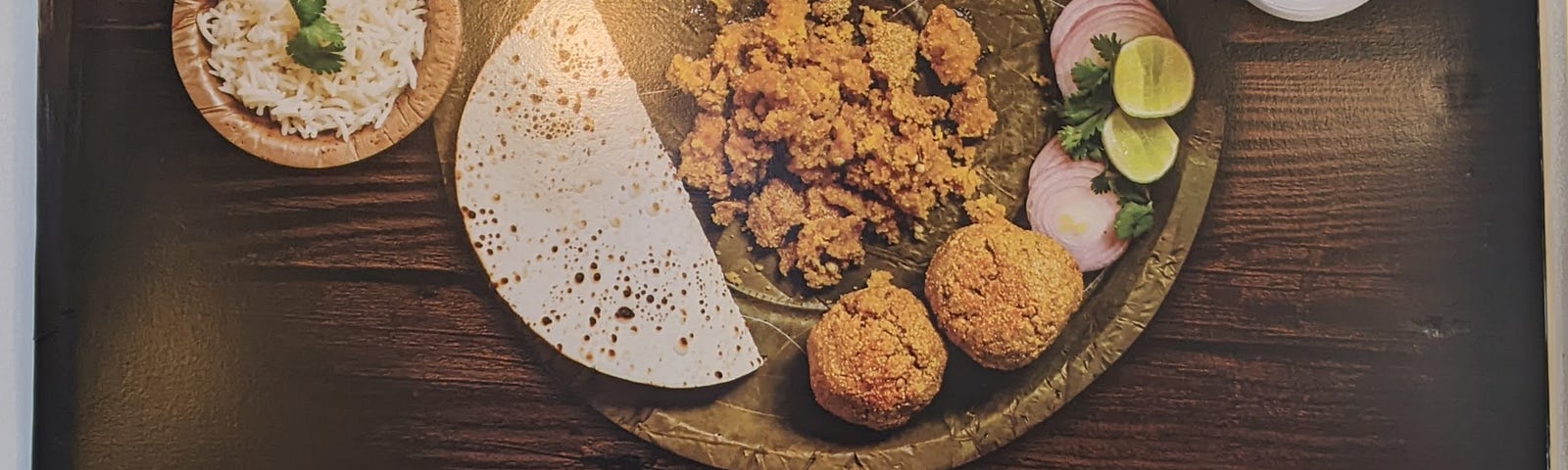 Photo of an advertisement for dal-bati thali — a specialty of Rajasthan state in India