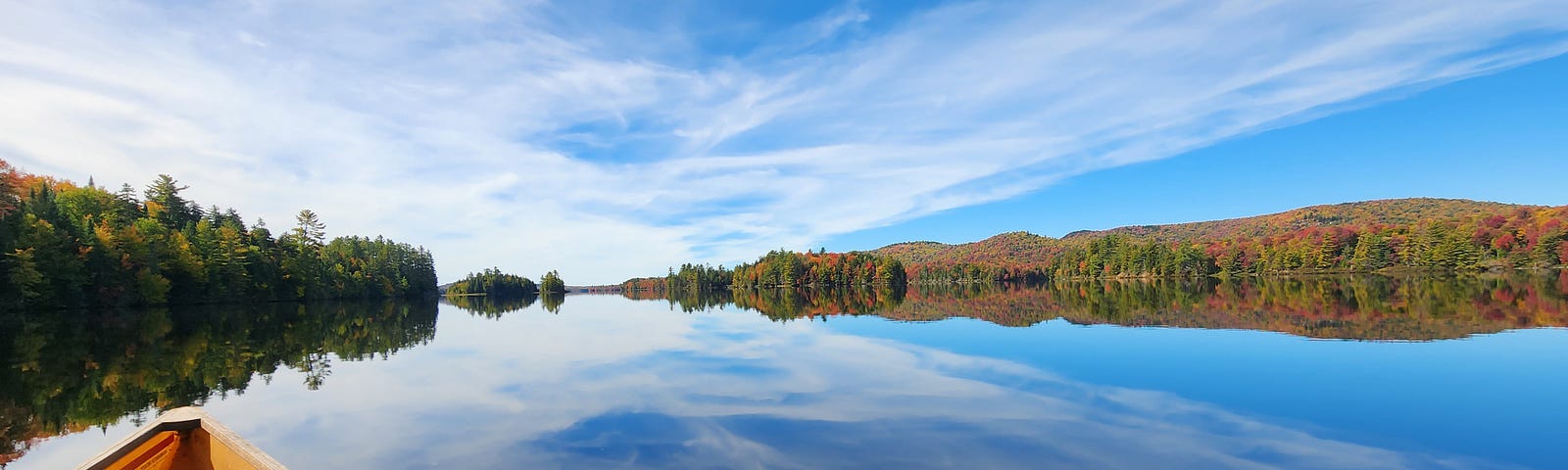 Lows lake calm day autumn colors captured by Author.