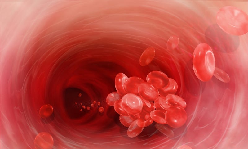 An illustration of the inside of a red blood vessel with a clump of red blood cells traveling through it.