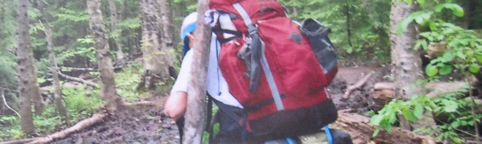 Author hiking muddy trail in Michigan.