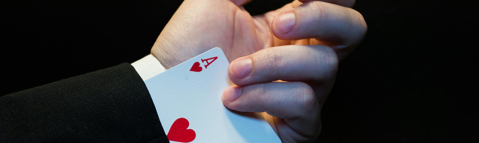 Person Holding Ace of Heart Playing Card