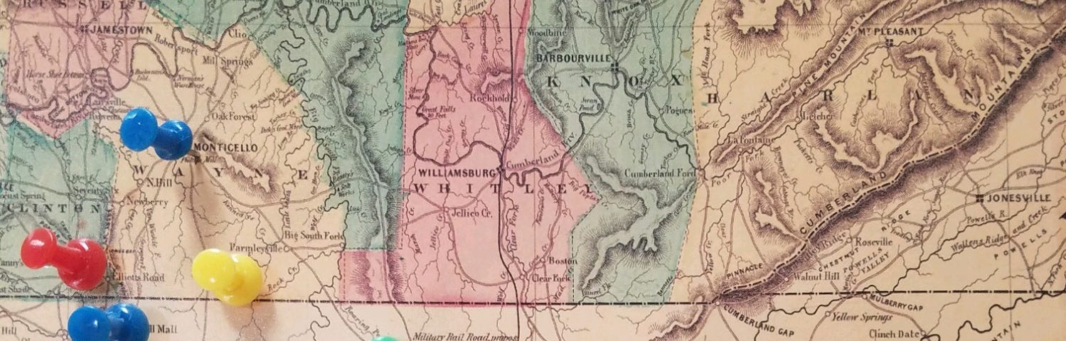 Civil War era railroad map on the TN/KY border hanging on my wall. Blues and green tacks are branches of the family on either side of the Cumberland Plateau. Red and yellow are places of significant events. Photo by author.