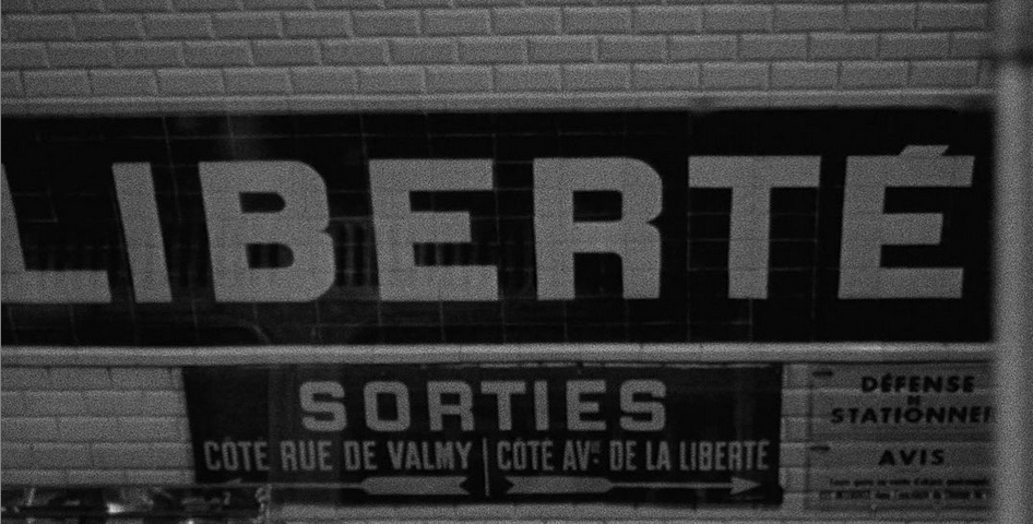 Screen shot from Bande à part (1964) by Jean-Luc Godard. Image of French signs in a subway station. Subtitle says, “Things are what they are.”