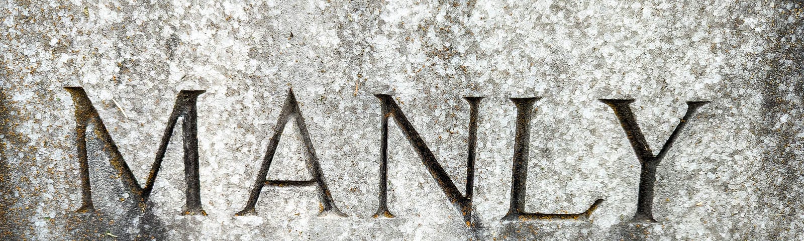 Gravestone bearing the word “MANLY”. Don’t read anything into the fact that this is a gravestone