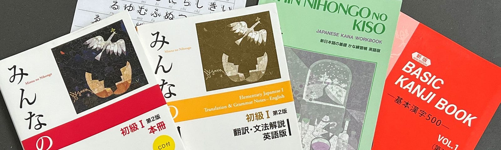 An array of textbooks and worksheets for learning Japanese.