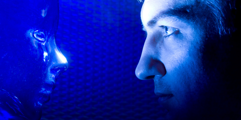 Man looking at a plastic mask in blue light — How To Not Be Your Own Worst Enemy