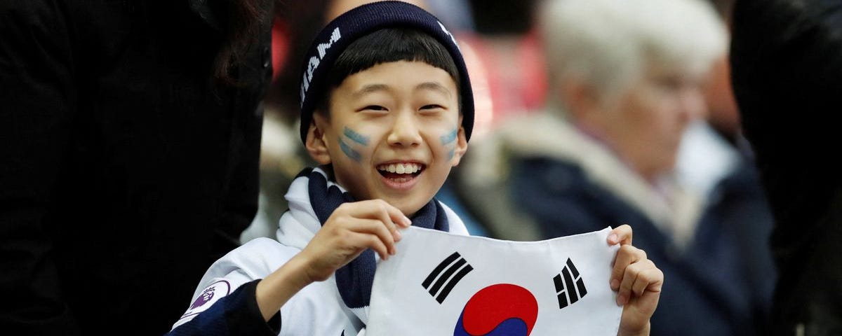 A child holding the South Korean national flag. Credits: Reuters.com