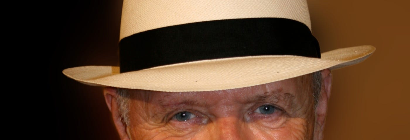 Portrait of Sir Anthony Hopkins at Tuscan Sun Festival 2009 in Cortona, Italy. He is wearing a beige jacket, a white shirt and a light beige hat with a black ribbon.