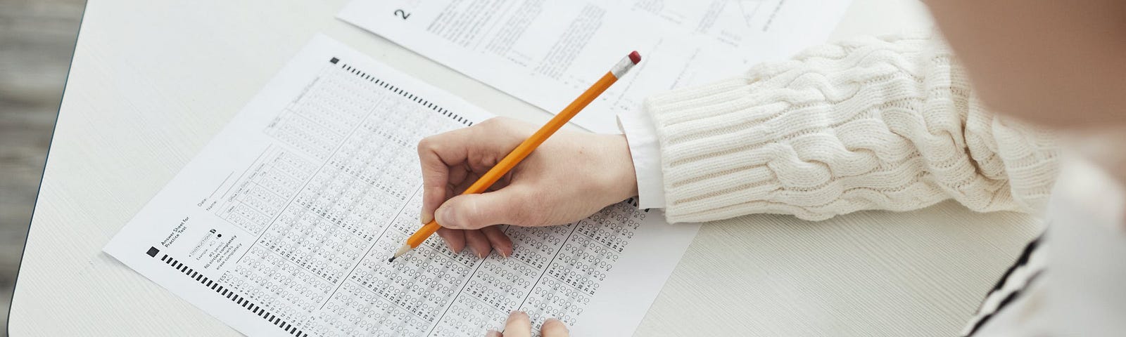 student filling out scantron test form