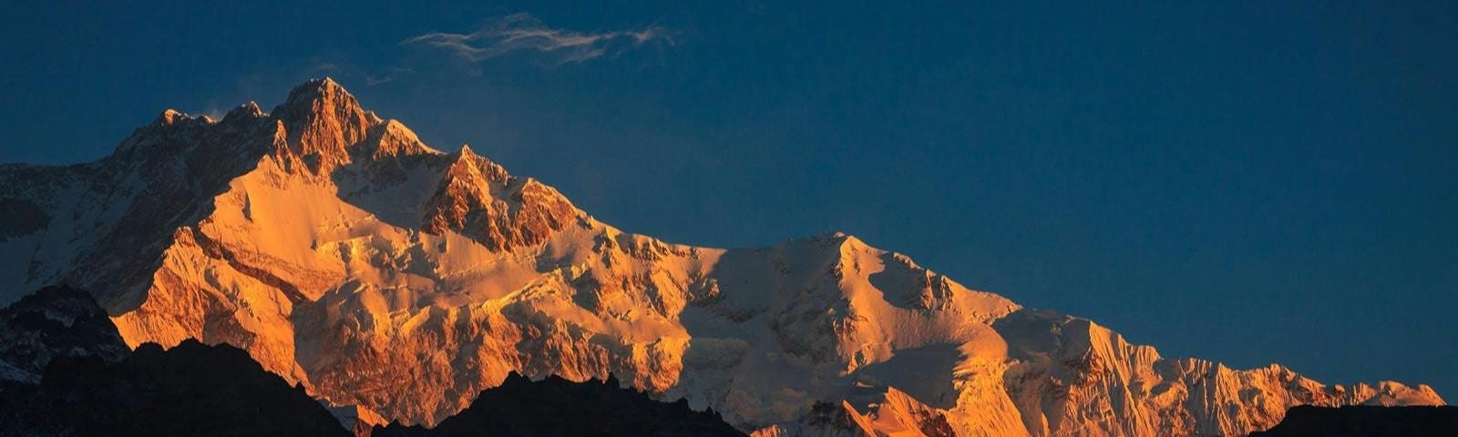 A view of the first light on the Mt. Kanchenjunga range from the Dzongri Top, taken by Prasath for India Hikes