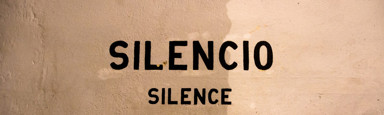 A wall that has the word Silence on it.