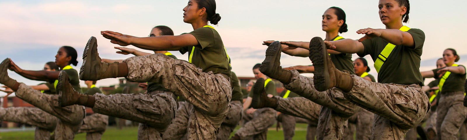 Marine Corps recruits conduct warm-up stretches to prepare for a fitness test at Marine Corps Recruit Depot Parris Island, South Carolina, July 11, 2019. Photo by Gunnery Sgt. Tyler Hlavac/U.S. Marine Corps