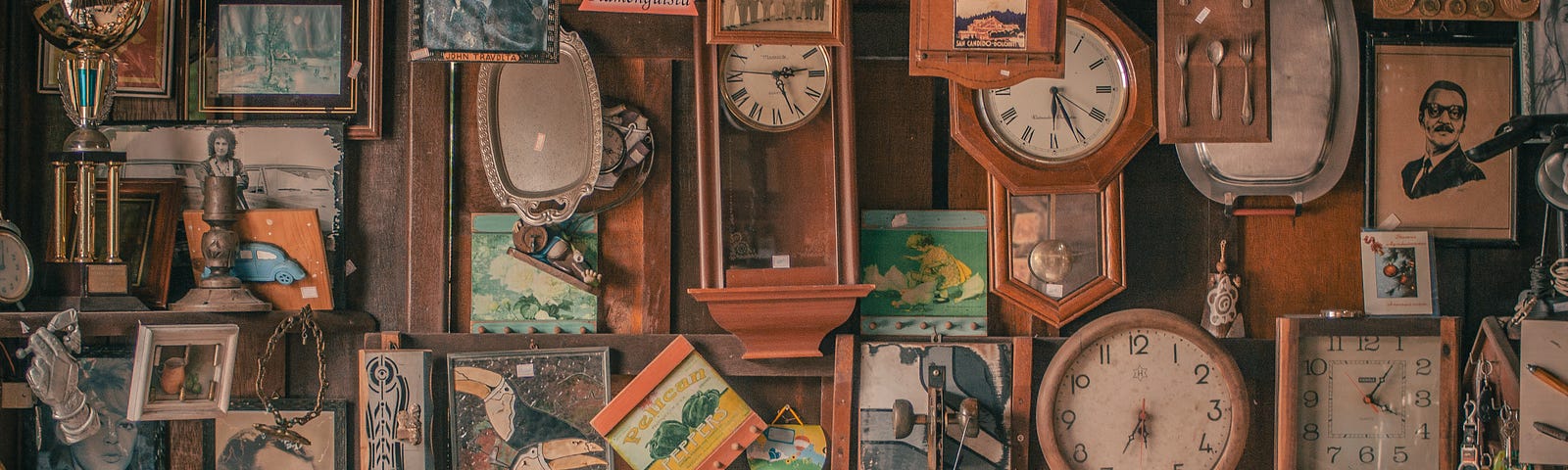 Wall covered with objects, from clocks to spoons to paintings.