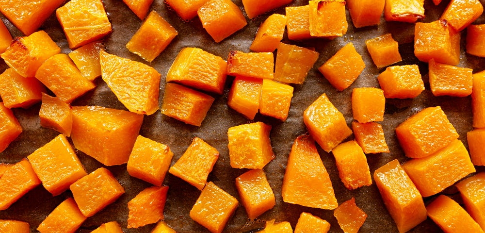 Roasted butternut squash on a sheet pan.