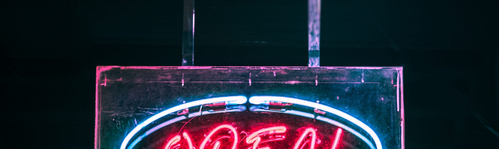 ‘Open’ sign in neon red and blue.