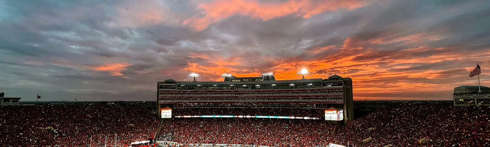 The sun sets during a sold-out Husker Football game