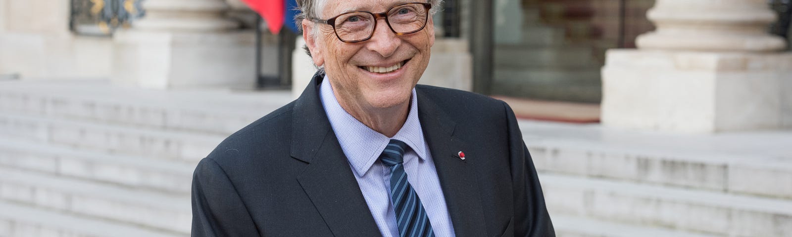 A photo of Bill Gates smiling.