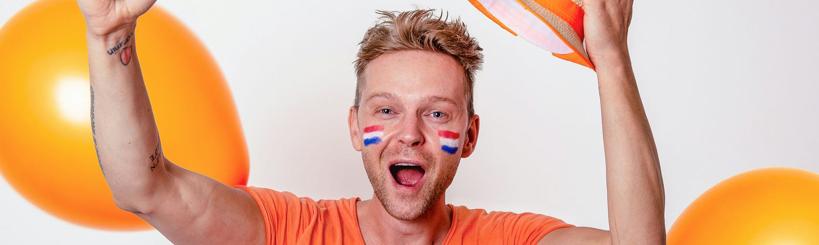 A Dutch fan dressed in orange