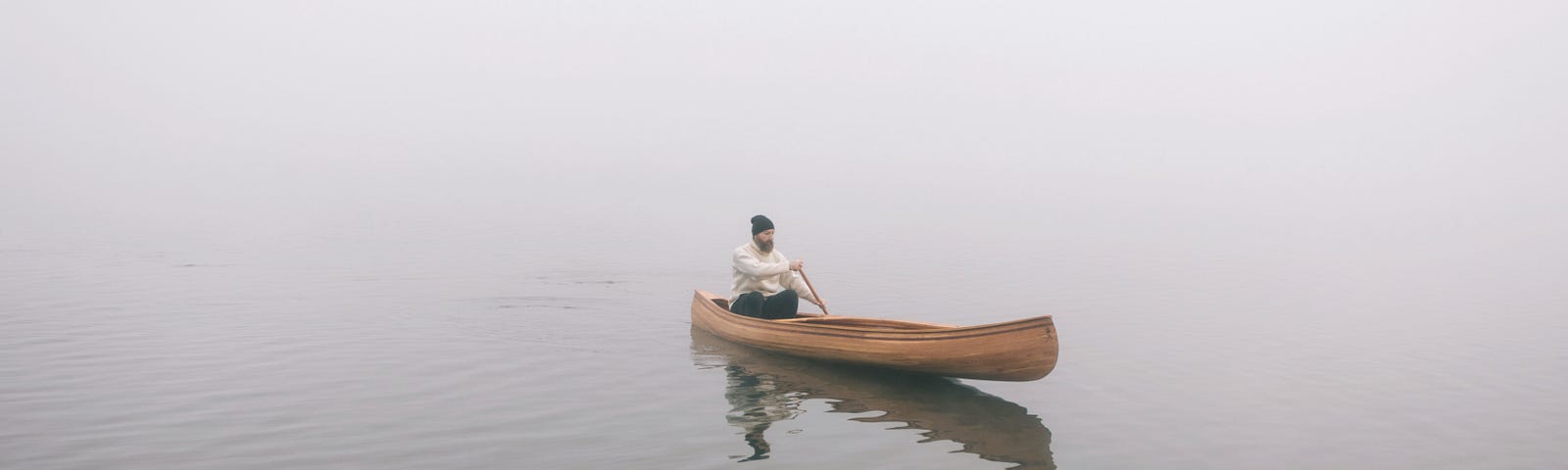 Man rowing boat in silence