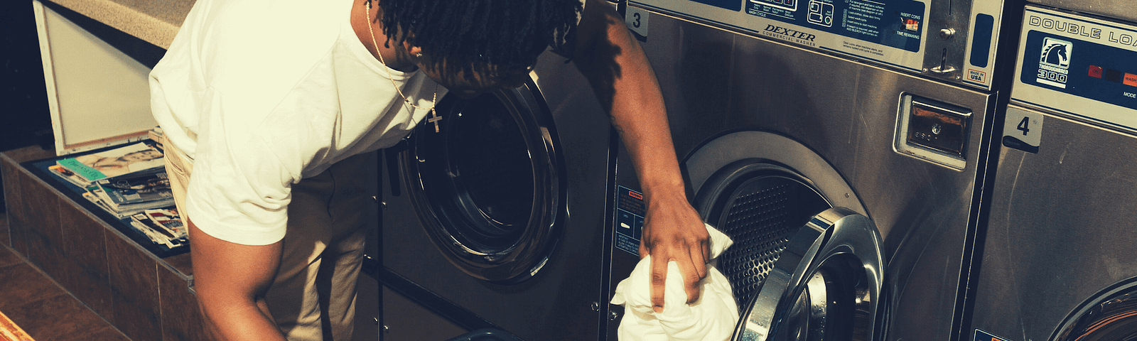 Person doing laundry — a chore. Not a practice.