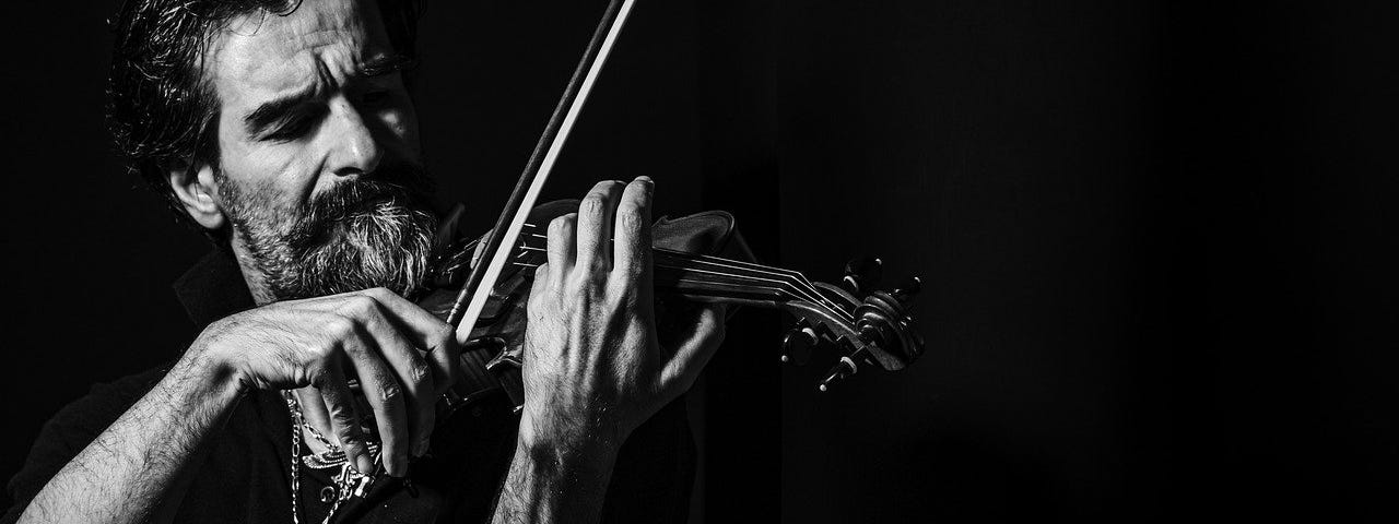 Man playing violin, black and white image