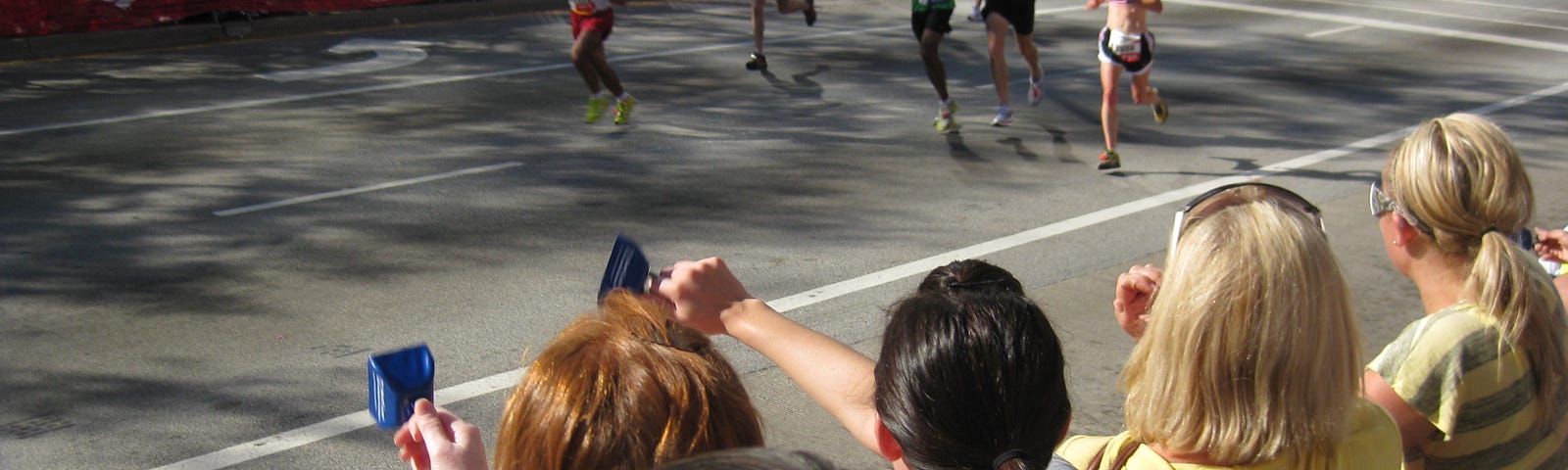Runners entering the finish chute for a marathon