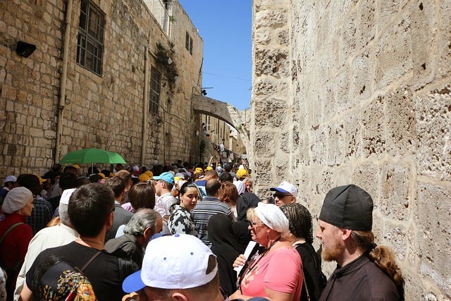 Pilgrims from all over the world — walking on the Via Dolorosa