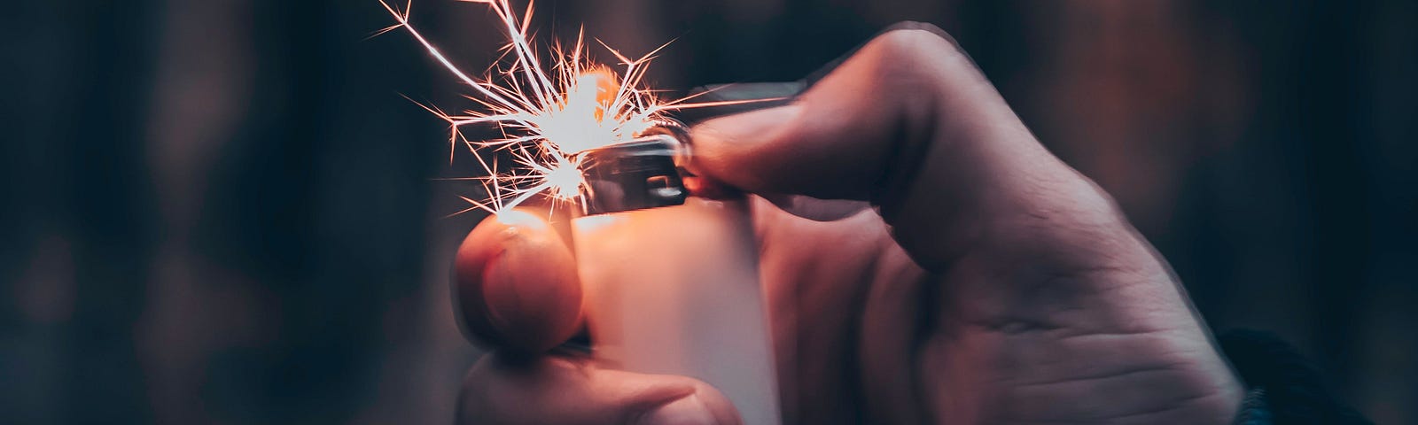 Hand lighting up a lighter