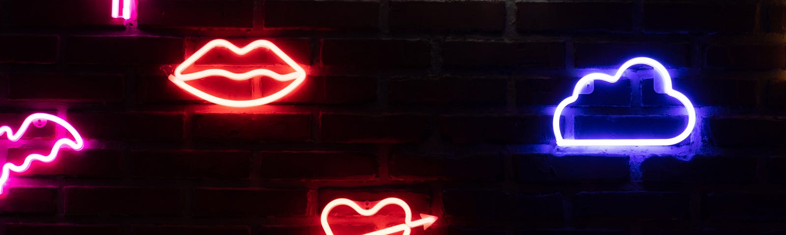 Neon signs, with words “Rock Star” at top, and with hearts, cactus, cloud, banana, rainbow, etc. in neon lights underneath