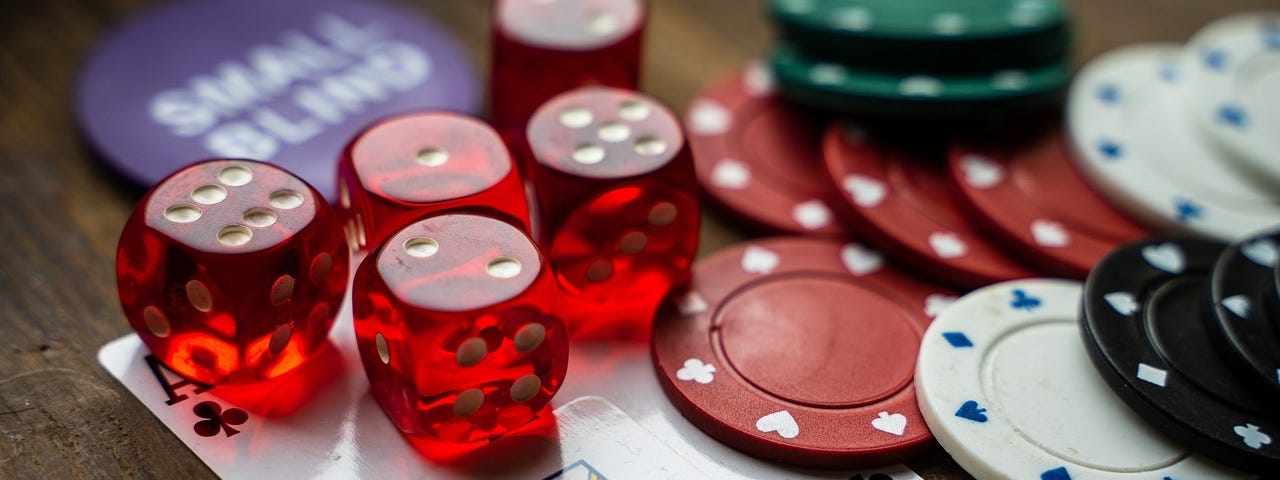Gambling table with dice, cards, and chips