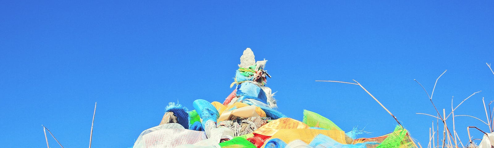 A pile of colorful plastic bags representing plastic pollution.