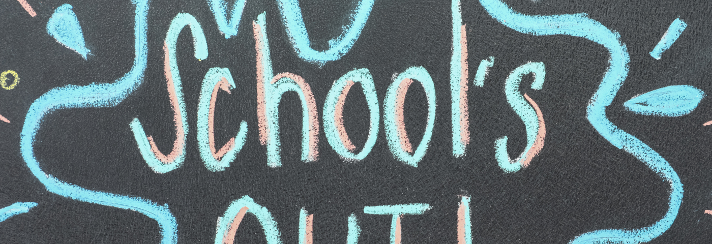 Image says “School’s Out” written on a chalkboard