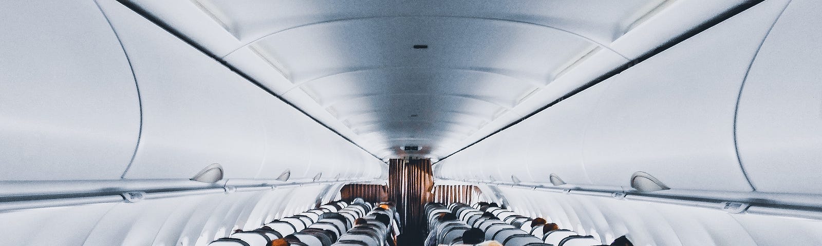 Image showing the front rows and aisle of a commercial airplane