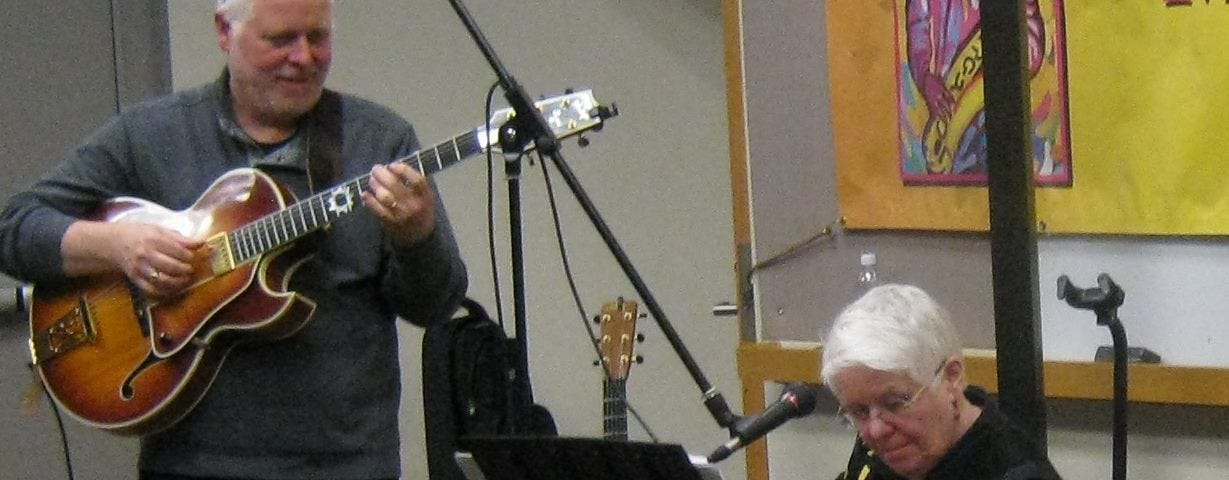 author pictured playing bass with Jamie Findlay on Anacortes stage