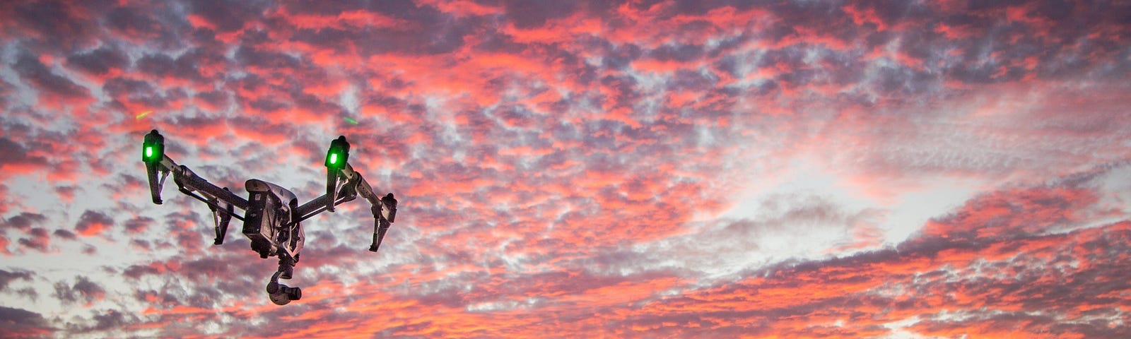 Drone flying at sunset