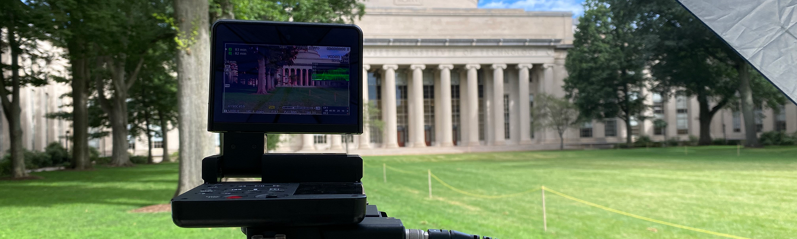 Photo of a video camera on the lawn in front of MIT’s Great Dome.
