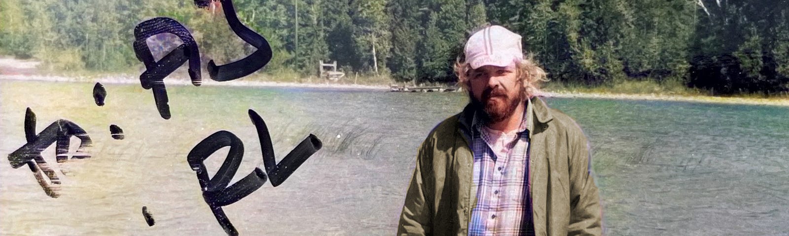 Photo of my father on a fishing trip, sent as a postcard to me.