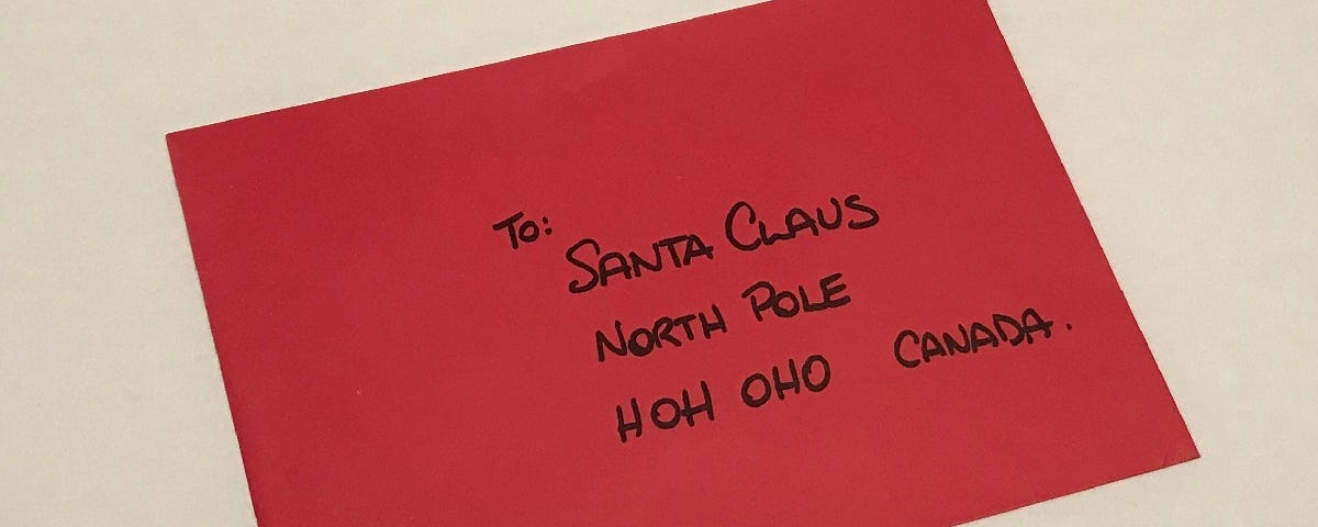 A red envelope addressed to Santa Claus.