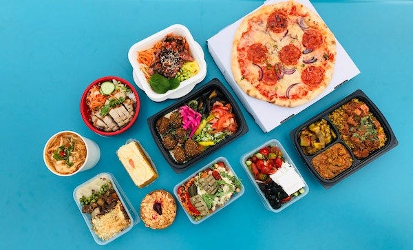 various dishes of food arranged against a blue background